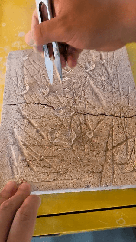 Water-beading demonstration on a treated mineral sample
